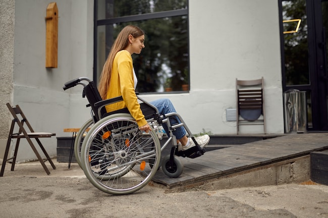 disabled-student-in-wheelchair-at-the-ramp-in-cafe-2021-10-04-22-19-20-utc-1 (3)